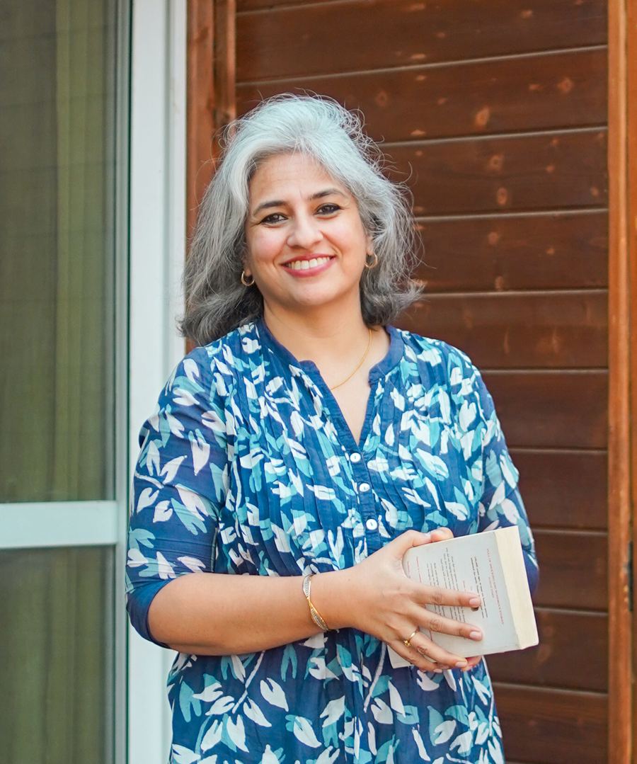 Nina Saxena holding a book